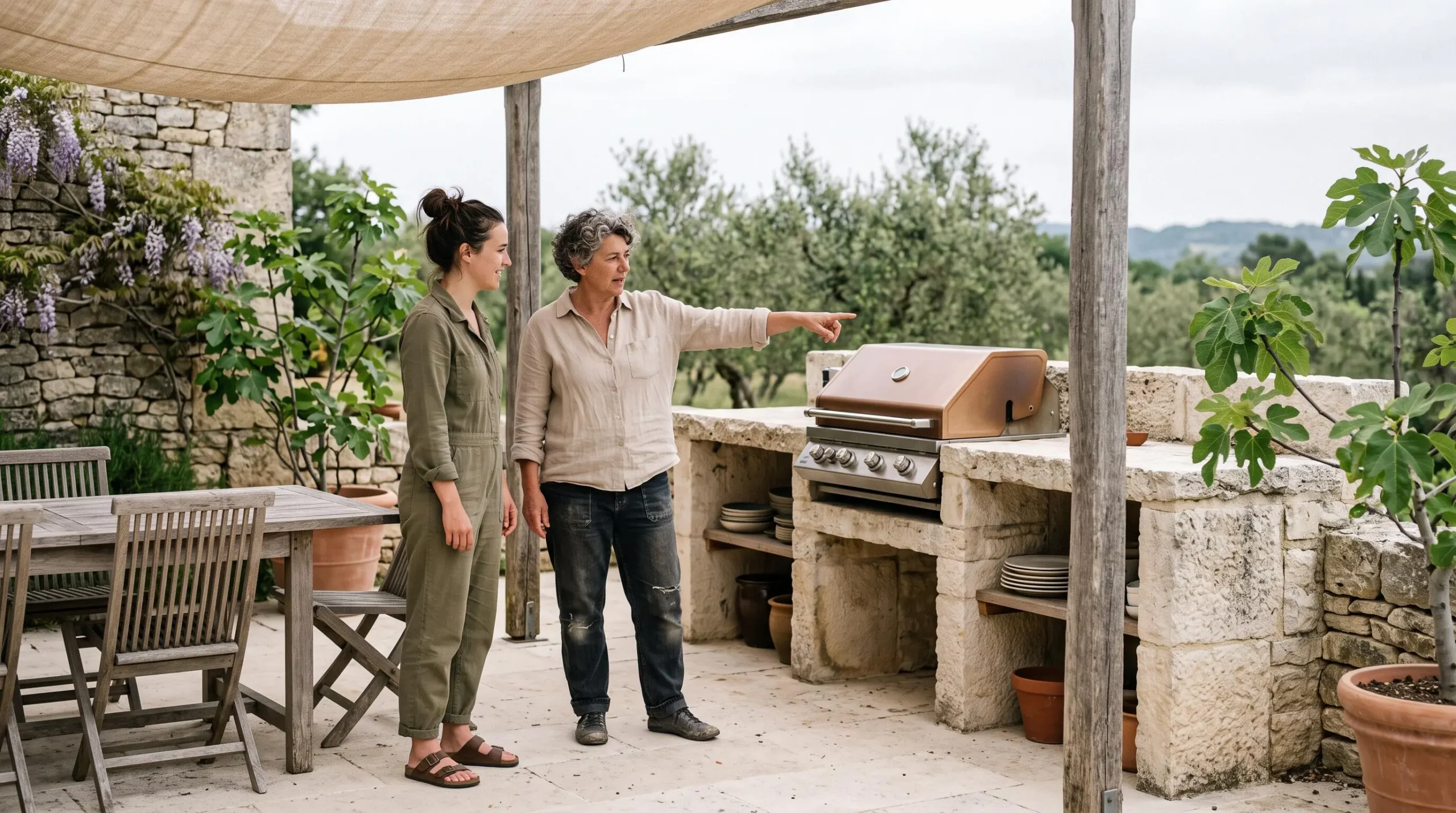 A villa owner explaining the terrace features to a visiting guest.
